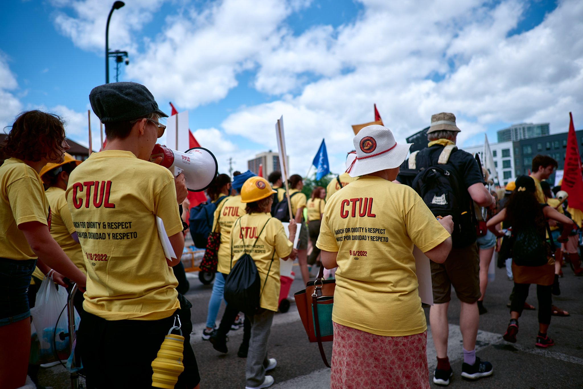 A group of people marching wearing CTUL BDR shirts