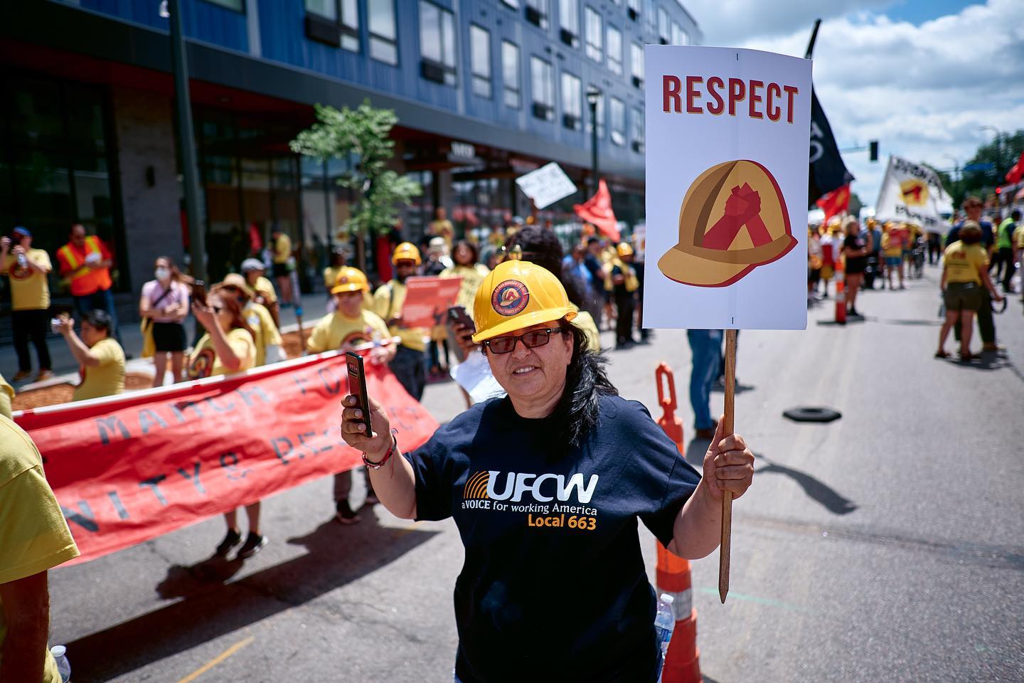 A worker in a construction hat at a BDR march