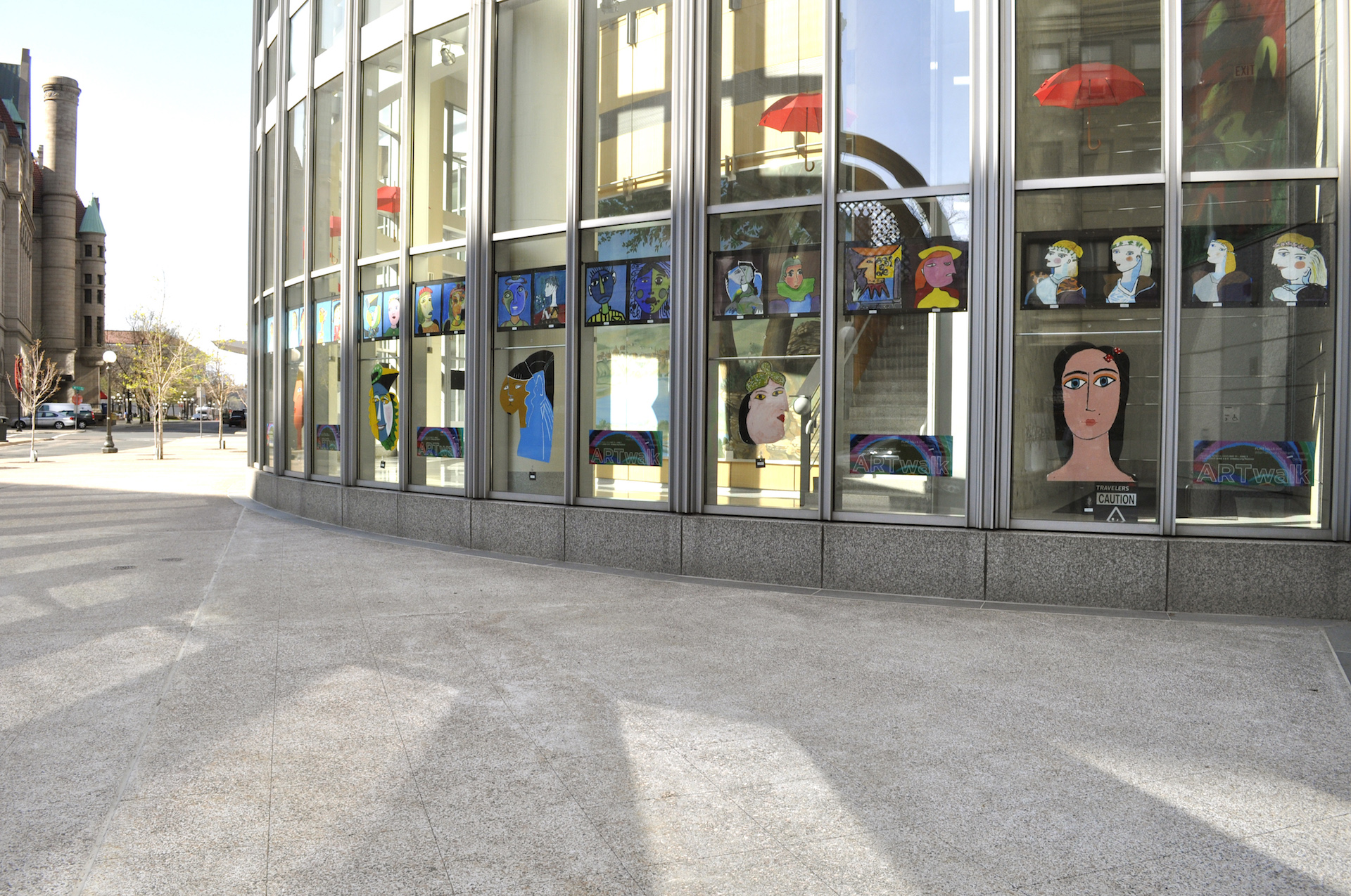 colorful portraits installed at travellers building